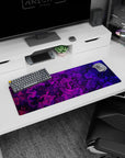 Small but impactful 32x12 desk mat showcases artistic energy with striking purple-and-pink artistry
