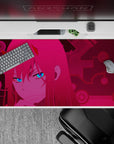Futuristic 40x20 mouse pad showcases Zero Two’s piercing eyes against a vibrant circuit world, blending anime charm with tech-inspired style