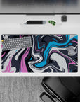 Vibrant 32x16 mouse pad with dynamic swirls of pink, blue, and charcoal, perfect for adding artistic energy and color to your desk