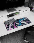 Creative 28x12 mouse pad with bold pink, blue, and charcoal swirls, perfect for adding artistic energy to your desk