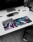 Fluid 32x12 mouse pad with abstract pink, blue, and charcoal swirls, perfect for bringing creativity and movement into your workspace
