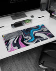 Bold 32x16 mouse pad with abstract wave-inspired swirls in pink, blue, and charcoal for a vibrant, creative touch to your workspace