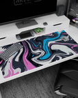 Bold 40x20 anime desk mat with abstract wave-inspired swirls in pink, blue, and charcoal, perfect for adding fluid creativity to your desk