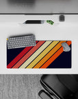 28x12 inches mouse pad with a retro diagonal stripe design, blending warm tones of orange, red, and yellow on a navy background for vintage style.