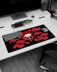 Celebrate shinobi power with 32x16 mouse pad showcasing Uchiha's iconic symbol and red cloud theme