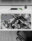 32x16 inches mouse pad showcasing Guts with his Dragonslayer sword in action, ideal for fans of Berserk seeking a bold, intense design for their workspace.