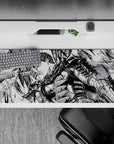 36x16 inches desk pad showcasing Guts in action with his Dragonslayer sword, a high-contrast design that captures the relentless spirit of the Black Swordsman.