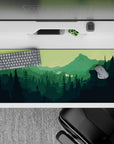 36x16 inches mouse pad with a hiker's silhouette and rich greens, creating a serene outdoor-inspired workspace vibe.