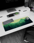 Artistic 32x12 inches mouse pad featuring a hiker's silhouette and rich greens for a tranquil and adventurous look.