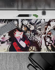 Deep black and white desk pad with punchy crimson blazer accents, bold risky vibe, 40x20 inches.