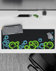 Intense 32x12 desk mat features vibrant bubbles and dark backdrop with intricate details for fans of abstract art