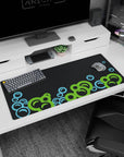 Dynamic artwork on 36x16 desk mat captures the essence of playful abstraction with bold, floating elements