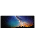 Milky Way night hike desk mouse pad, 32x12 inches, with starry sky and amber horizon glow.