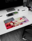 Red-haired anime girl lounging on a pink pillow mouse pad 28x12 inches, golden eyes and tiny crown clip.