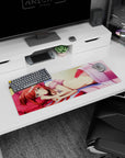Red-haired anime girl lounging on blue sheets and pink pillow mouse pad 32x12 inches, golden eyes sparkling.