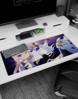 Winking long pink-haired anime girl on 36x16 inches desk pad, sleek black suit in a purple scene.