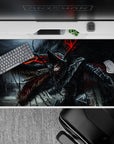 40x20 inches desk pad showcasing Guts in his Berserker Armor, battling the Beast of Darkness, capturing the fierce rage and destruction from the series for your desk setup.