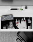 Anime mouse pad 32x12 inches featuring Sharingan eyes, with monochrome shadows, evoking drama and haunting beauty.