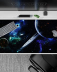 Dreamy neon-blue and deep black desk pad 40x20 inches with green nebula haze and sci-fi night vibe.