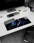 Giant ringed planet with ember-like cracks under a star-splashed sky, 28x12 inches desk mouse pad.