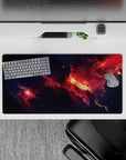 Inky navy to ember red and glowing orange clouds, cozy dramatic desk pad, 32x16 inches.