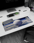 Giant moon-like orb floating in blue sky mouse pad 32x12 inches, quiet orbit scene with gentle rings.