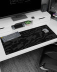 Artistic 36x16 inches mouse pad featuring black-on-black camouflage, with textured charcoal and graphite patterns for a quiet, bold statement.