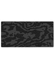 Mouse pad featuring black-on-black camouflage, 32x16 inches, with charcoal and graphite textures to create depth and sophistication for a modern workspace.