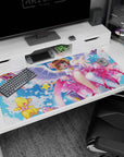 Sakura Kinomoto reaching out with Kero-chan, fluttering Clow Cards and ribbon swirls desk pad, 40x20 inches.