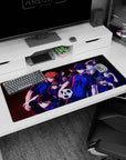 Isagi Yoichi front and center on Blue Lock desk pad 36x16 inches, teammates crowding behind.