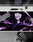 Dynamic 40x20 inch anime desk pad showcasing Gojo's overwhelming force with intense energy and style