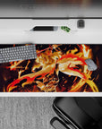 Rengoku from Demon Slayer on 36x16 inch mouse pad, fiery design with golden hair and sword in motion, vibrant colors.