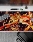 Rengoku anime desk pad 40x20 inches with blazing colors from Demon Slayer, featuring fiery hair and dynamic sword pose.
