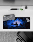 28x12 inches mouse pad with Guts in his Berserker Armor, surrounded by glowing blue light and jagged shadows, perfect for adding a dynamic, dramatic touch to your desk.