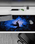 36x16 inches desk pad showcasing Guts in his Berserker Armor, with glowing blue light and jagged shadows, capturing the raw intensity of battle for your workspace.