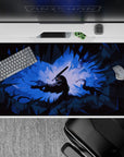 40x20 inches desk pad showcasing Guts in his Berserker Armor, with jagged shadows and glowing blue light, capturing the tense energy of battle in a visually striking design.