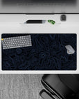 Dynamic 32x16 desk mat combines intricate blue lines and deep tones for impactful yet soothing visuals