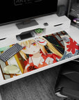 Shy blonde anime girl with orange eyes and a hidden fox mask on a 40x20 inches desk pad.