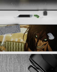 Rage and power 36x16 desk pad featuring Eren Yeager’s Attack Titan with glowing green eyes, crackling lightning, and a determined smirk for an intense desk atmosphere