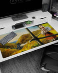 Fox-eared anime girl desk pad 40x20 inches, scarf up, watching a misty valley over autumn hills.