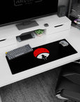 Anime mouse pad 32x12 inches featuring Itachi Uchiha against a red Uchiha crest, perfect for devoted Naruto fans.