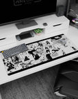 Anime desk pad 36x16 inches featuring Naruto moments: Madara, Minato, Jinchūriki army, and Reverse Harem Jutsu in black and white.