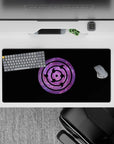 Anime mouse pad 32x16 inches featuring Naruto's Rinnegan symbol on a cosmic purple nebula background, combining Uchiha mystery and galactic vibes.