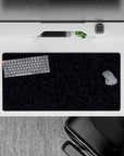 Dynamic 32x16 desk mat combines delicate purple lines and black tones for impactful yet calming visuals