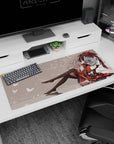 36x16 inches anime girl mouse pad with dark-haired girl lounging in frilly dress and glossy thigh-highs.