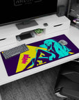 Long-haired anime girl lounging pin-up style on desk pad 36x16 inches, jacket draped over bodysuit.