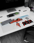 Kaneda in red jumpsuit walking past hovering red bike on an anime desk pad 36x16 inches.