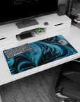 Artistic 32x16 inches mouse pad featuring swirling waves and pixelated dinosaurs, blending fun and cosmic vibes for a unique workspace.