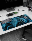 Playful 36x16 inches desk pad featuring blue and black cosmic waves with pixelated dinosaurs, perfect for adding charm to your setup.