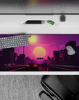 36x16 inches desk pad with Sunset Drive Rush, showcasing a retro-futuristic highway scene with glowing cars and a colorful sunset over the city.